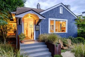 Craftsman-style house featuring new durable roofing and siding in St. Cloud, MN.