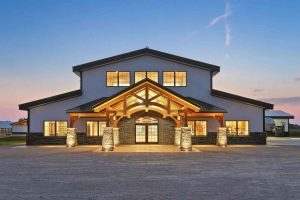 Durable pole barn siding installed on a large barn structure by Committed Roofing & Exteriors.
