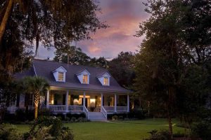 Traditional Colonial home showcasing updated roofing work by Committed Roofing & Exteriors.